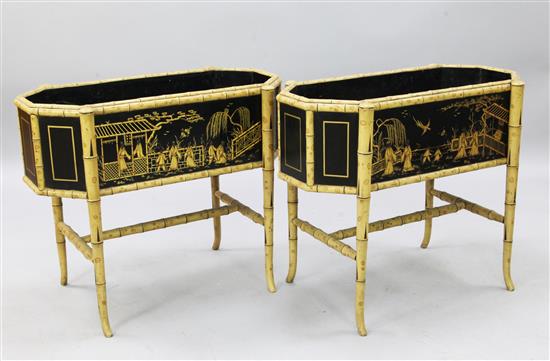 A pair of simulated bamboo and ebonised oak jardinieres, W.2ft 8in. D.1ft 5in. H.2ft 3in.